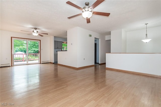 4671 Milford Dr, Perry, OH 44081 - unfurnished living room featuring ceiling fan, baseboard heating, and light wood finished floors