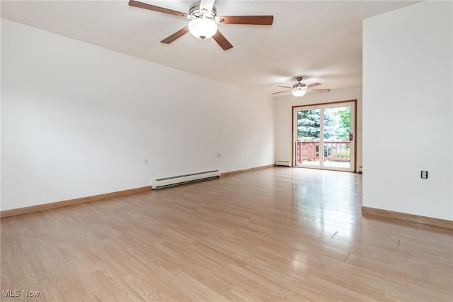 4671 Milford Dr, Perry, OH 44081 - spare room with a baseboard radiator, ceiling fan, and light wood-type flooring