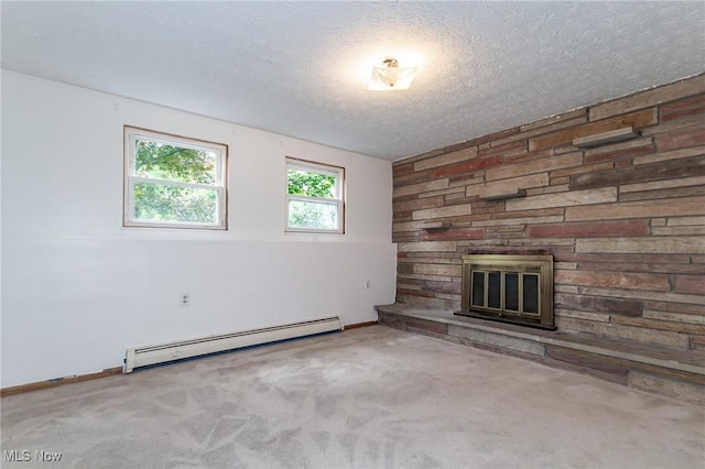 4671 Milford Dr, Perry, OH 44081 - unfurnished living room with a baseboard heating unit, a fireplace, a textured ceiling, and carpet flooring