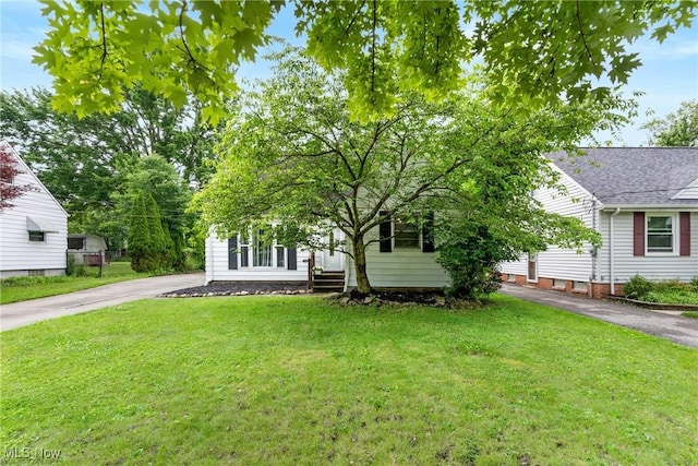 120 Palmetto Ave, Bedford, OH 44146 - obstructed view of property featuring driveway and a front lawn