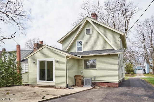 2231 16th St, Cuyahoga Falls, OH 44223 - rear view of property with a chimney