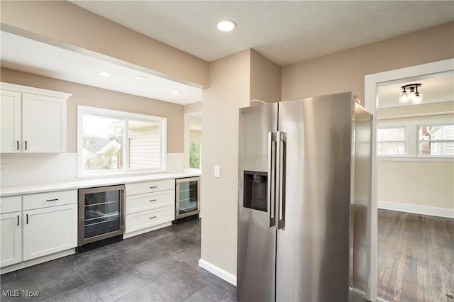 2231 16th St, Cuyahoga Falls, OH 44223 - kitchen featuring stainless steel fridge, beverage cooler, white cabinets, light countertops, and recessed lighting