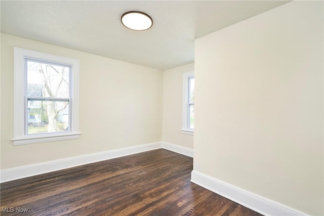 2231 16th St, Cuyahoga Falls, OH 44223 - empty room with plenty of natural light and dark wood-style flooring