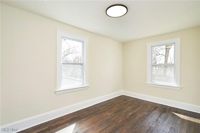 2231 16th St, Cuyahoga Falls, OH 44223 - empty room featuring baseboards and dark wood-style flooring
