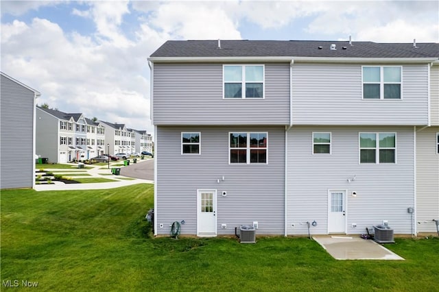 393 Slate Rdg, Barberton, OH 44203 - rear view of house with a lawn, a patio, and a residential view