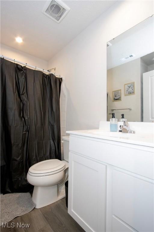 393 Slate Rdg, Barberton, OH 44203 - full bath with wood finished floors, vanity, and a shower with shower curtain