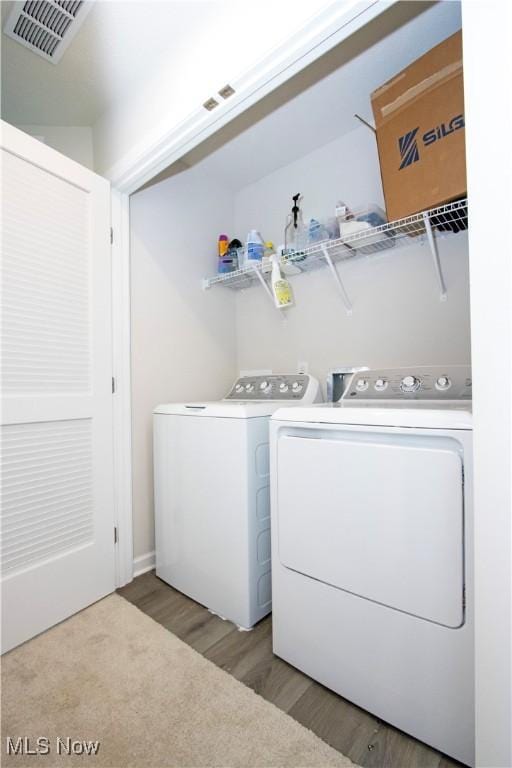 393 Slate Rdg, Barberton, OH 44203 - laundry area featuring separate washer and dryer and light wood-style flooring