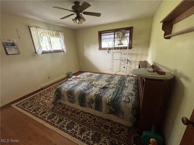 223 Sunset Ct, Columbiana, OH 44408 - bedroom with baseboard heating and a ceiling fan