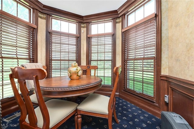 23225 Wingedfoot Dr, Westlake, OH 44145 - dining space featuring ornamental molding, a decorative wall, and a wainscoted wall