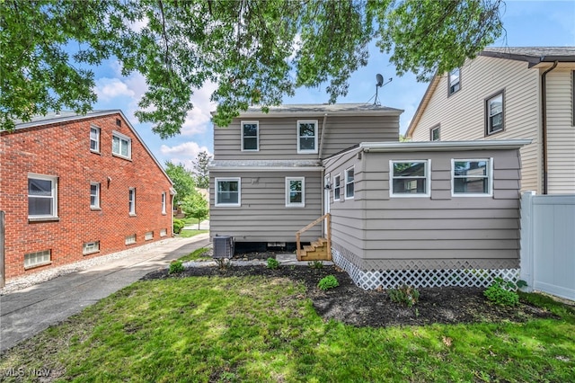 3726 W 169th St, Cleveland, OH 44111 - rear view of house with entry steps and a lawn