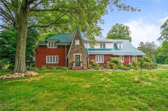 3571 Greenwich Rd, Barberton, OH 44203 - view of front facade featuring a chimney, a front yard, a metal roof, and a standing seam roof