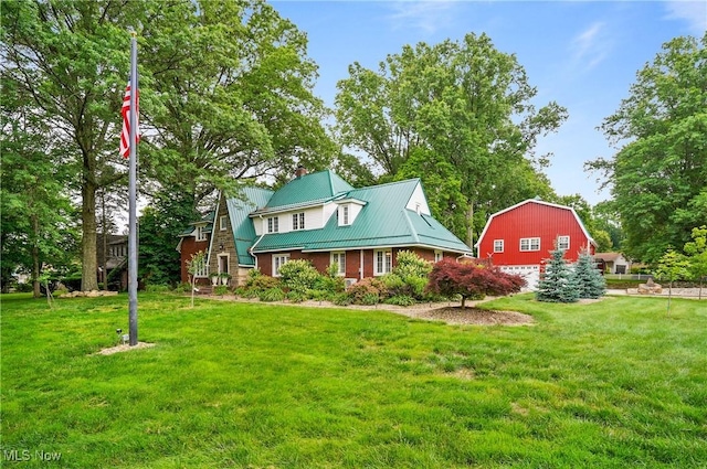 3571 Greenwich Rd, Barberton, OH 44203 - view of front of house with a front yard, a metal roof, a chimney, and a standing seam roof