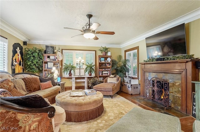 3571 Greenwich Rd, Barberton, OH 44203 - sitting room featuring ceiling fan, plenty of natural light, a fireplace with flush hearth, and ornamental molding