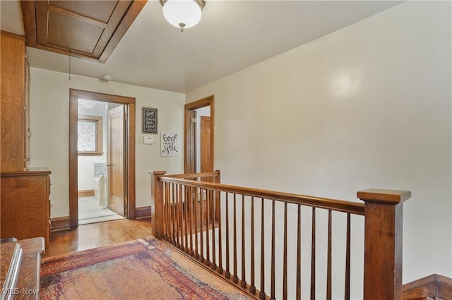 3571 Greenwich Rd, Barberton, OH 44203 - corridor with attic access, wood finished floors, and an upstairs landing