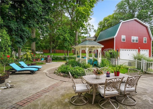 3571 Greenwich Rd, Barberton, OH 44203 - view of patio / terrace with a gazebo, a garage, and outdoor dining space