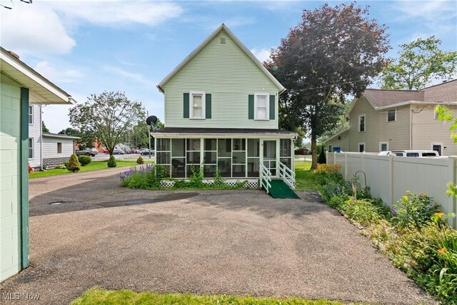 811 E High Ave, New Philadelphia, OH 44663 - rear view of property featuring a sunroom