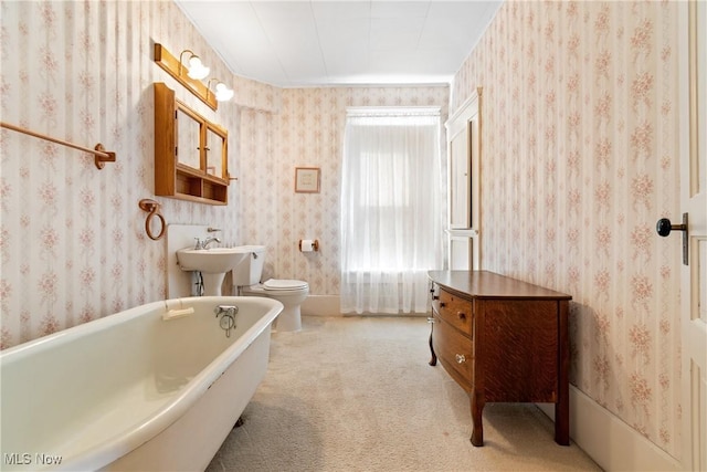 811 E High Ave, New Philadelphia, OH 44663 - bathroom featuring a freestanding bath and wallpapered walls