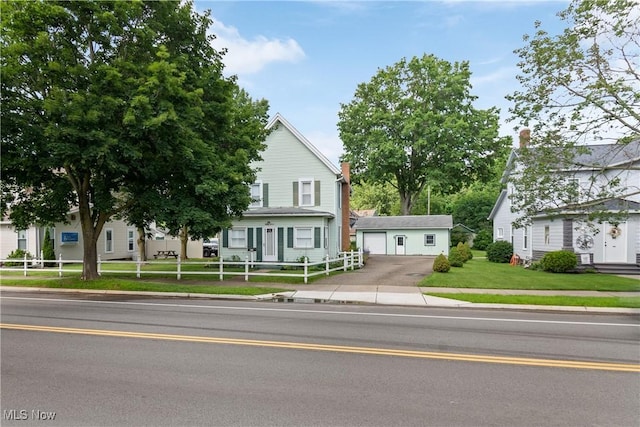 811 E High Ave, New Philadelphia, OH 44663 - view of front of home featuring a garage and an outdoor structure