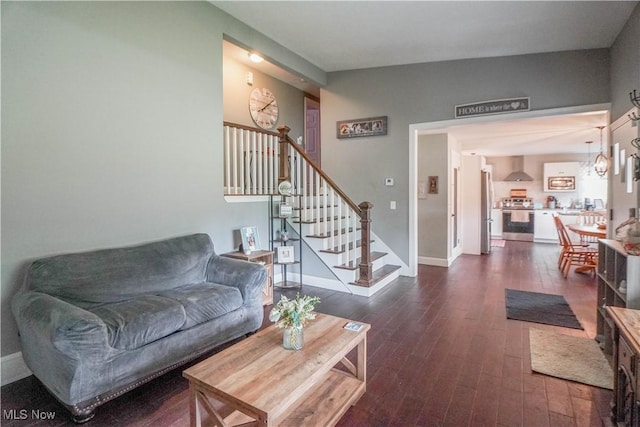 1324 Woodrow St NW, North Canton, OH 44720 - living room featuring dark wood-style flooring and stairs