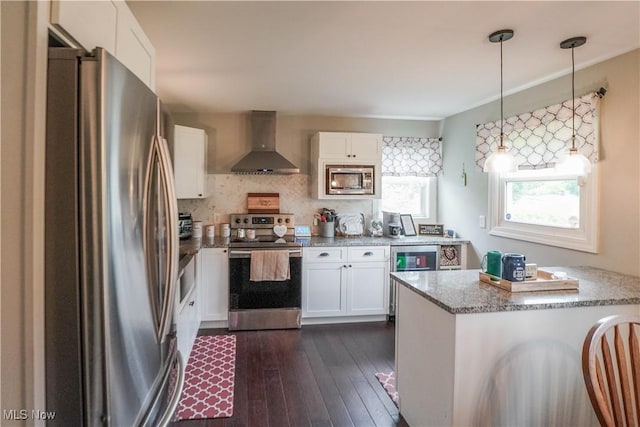 1324 Woodrow St NW, North Canton, OH 44720 - kitchen featuring appliances with stainless steel finishes, wall chimney range hood, white cabinets, and dark wood-style floors