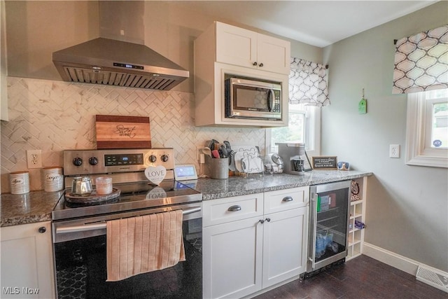 1324 Woodrow St NW, North Canton, OH 44720 - kitchen with stainless steel appliances, extractor fan, wine cooler, and decorative backsplash