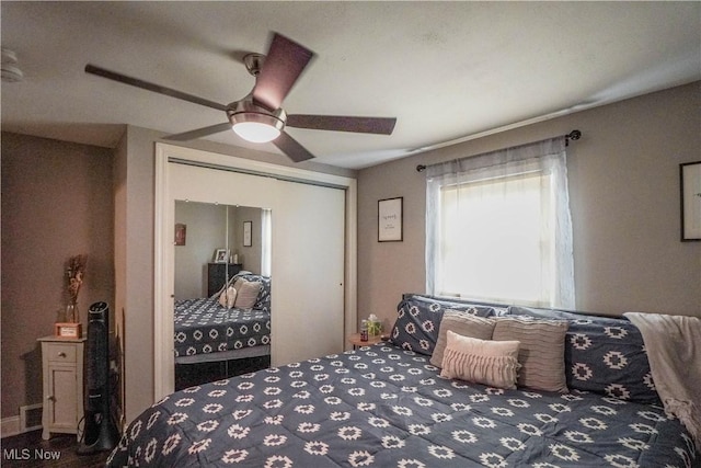 1324 Woodrow St NW, North Canton, OH 44720 - bedroom with a closet and ceiling fan