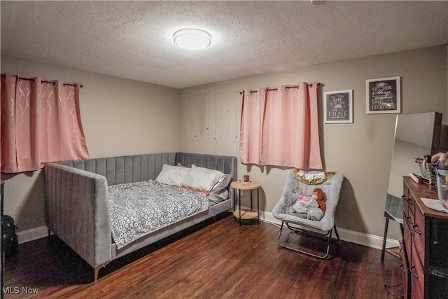 1324 Woodrow St NW, North Canton, OH 44720 - bedroom featuring wood finished floors and a textured ceiling