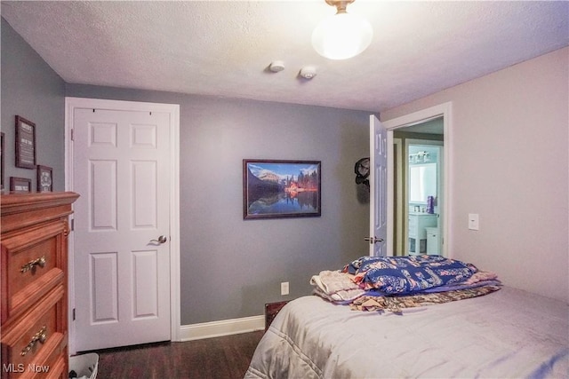 1324 Woodrow St NW, North Canton, OH 44720 - bedroom featuring dark wood-style flooring and baseboards