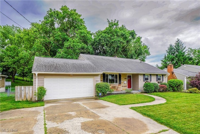 1324 Woodrow St NW, North Canton, OH 44720 - ranch-style house with an attached garage, driveway, and a shingled roof