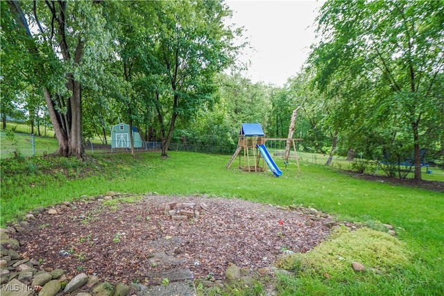 1324 Woodrow St NW, North Canton, OH 44720 - view of yard featuring a playground and a storage unit