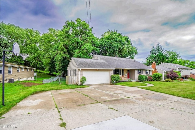 1324 Woodrow St NW, North Canton, OH 44720 - ranch-style house featuring an attached garage and driveway