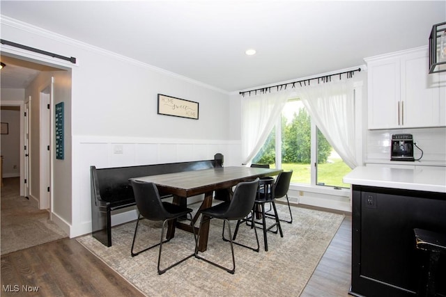 13946 Highview Dr, Dalton, OH 44618 - dining space with light wood-style floors, crown molding, a wainscoted wall, and recessed lighting