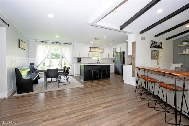 13946 Highview Dr, Dalton, OH 44618 - dining room featuring wood finished floors, recessed lighting, and beamed ceiling
