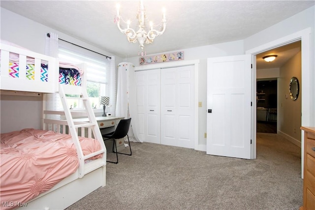 13946 Highview Dr, Dalton, OH 44618 - carpeted bedroom featuring a closet and a chandelier