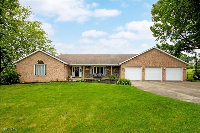 13946 Highview Dr, Dalton, OH 44618 - ranch-style home featuring an attached garage, driveway, covered porch, a front yard, and brick siding