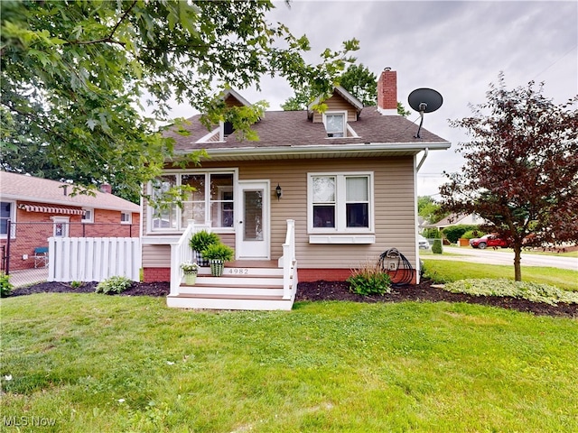 4982 14th St SW, Canton, OH 44710 - view of front of property with a chimney and a shingled roof