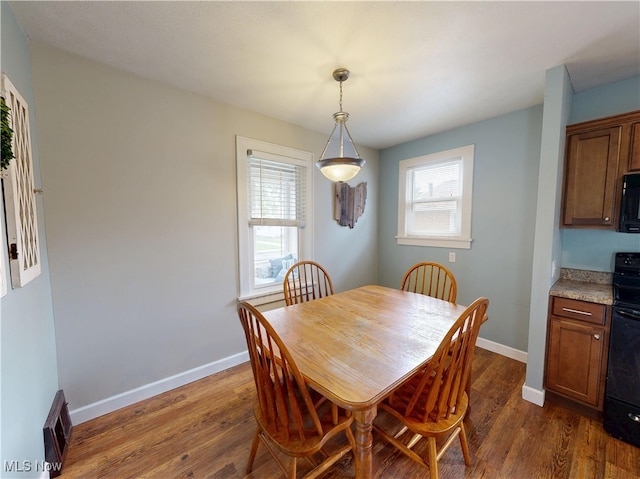 4982 14th St SW, Canton, OH 44710 - dining room with dark wood-style flooring