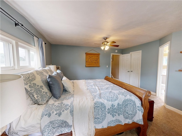 4982 14th St SW, Canton, OH 44710 - carpeted bedroom with ceiling fan, ensuite bath, and a closet