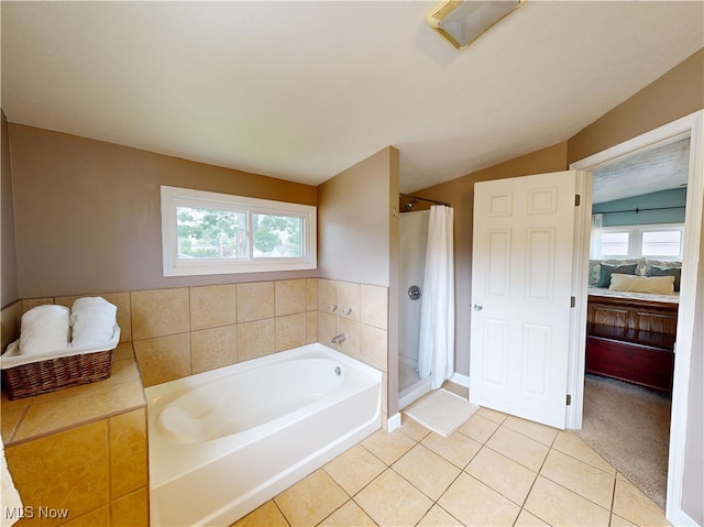 4982 14th St SW, Canton, OH 44710 - ensuite bathroom featuring a garden tub, a stall shower, tile patterned flooring, and lofted ceiling