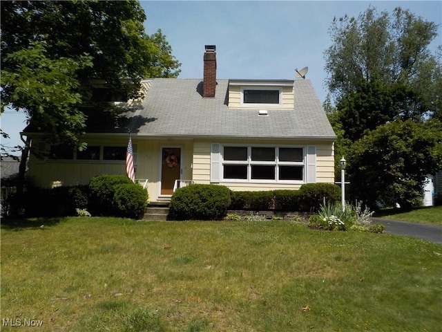 3130 Park Dr, Stow, OH 44224 - cape cod-style house featuring a front lawn and a chimney