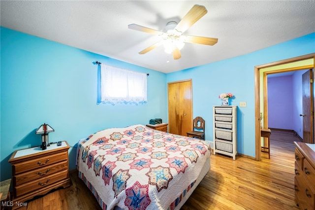 30888 Harrison Rd, Wickliffe, OH 44092 - bedroom featuring wood finished floors, a closet, and a ceiling fan