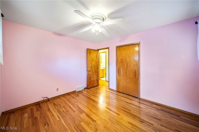 30888 Harrison Rd, Wickliffe, OH 44092 - unfurnished bedroom featuring light wood finished floors, a closet, and ceiling fan