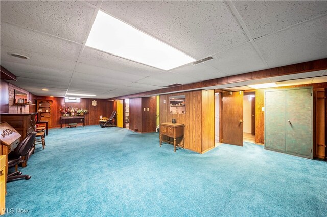 30888 Harrison Rd, Wickliffe, OH 44092 - finished basement with carpet, a dry bar, wood walls, and a paneled ceiling