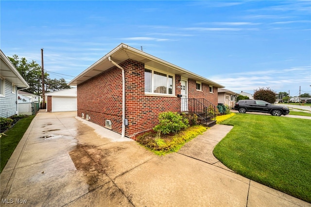 30888 Harrison Rd, Wickliffe, OH 44092 - view of side of property featuring brick siding, a lawn, a garage, and an outbuilding