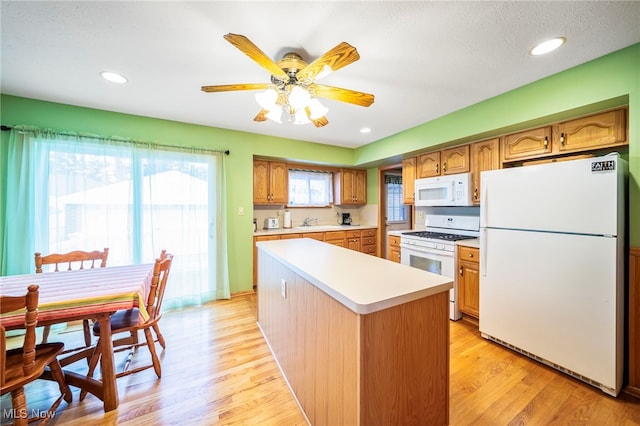 30888 Harrison Rd, Wickliffe, OH 44092 - kitchen with white appliances, light countertops, light wood-style floors, a ceiling fan, and recessed lighting