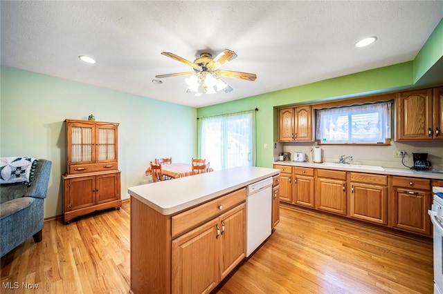 30888 Harrison Rd, Wickliffe, OH 44092 - kitchen with dishwasher, ceiling fan, light countertops, light wood-type flooring, and recessed lighting