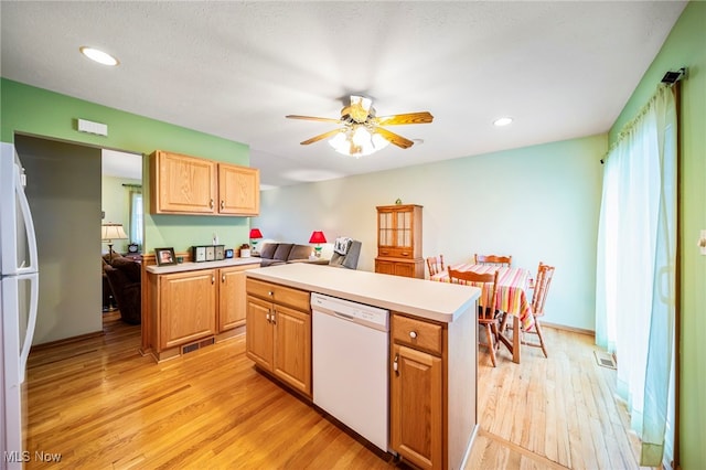 30888 Harrison Rd, Wickliffe, OH 44092 - kitchen with white appliances, light wood-style floors, ceiling fan, light countertops, and recessed lighting