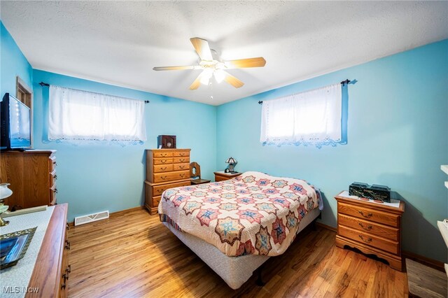 30888 Harrison Rd, Wickliffe, OH 44092 - bedroom with light wood finished floors and a ceiling fan