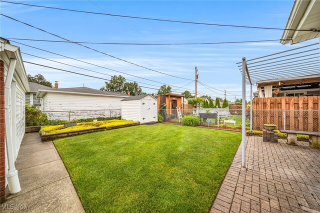 30888 Harrison Rd, Wickliffe, OH 44092 - fenced backyard featuring a storage shed and a patio