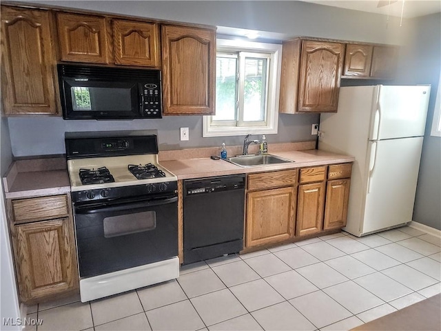 5752 Van Wert Ave, Brook Park, OH 44142 - kitchen with black appliances, light countertops, and brown cabinetry